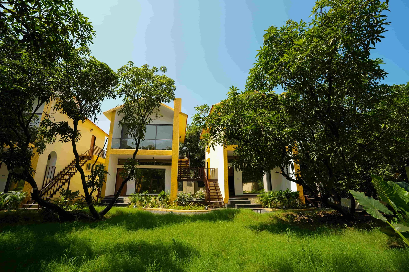 Resort buildings in a tree-filled garden