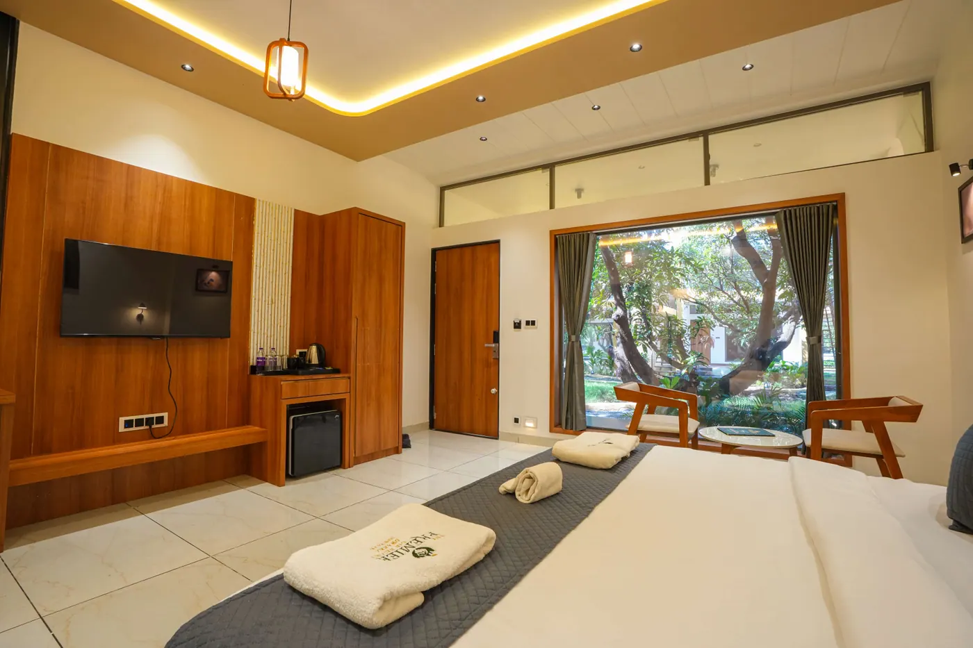 Girtara guest room with king bed and garden window